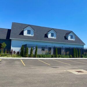 The backside of our facility and our fenced outdoor play area.